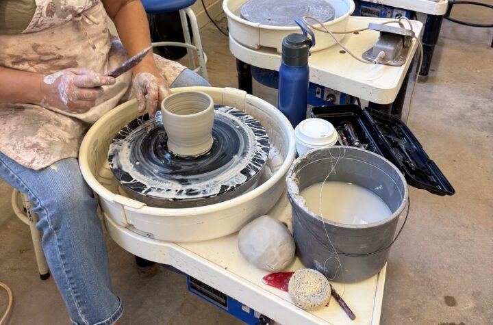 ceramics students working on the wheel